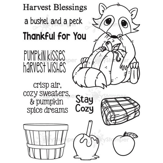 InkyStamper Stamp Black and white illustration with autumn-themed text and graphics, including a raccoon, pumpkin, and cozy elements.