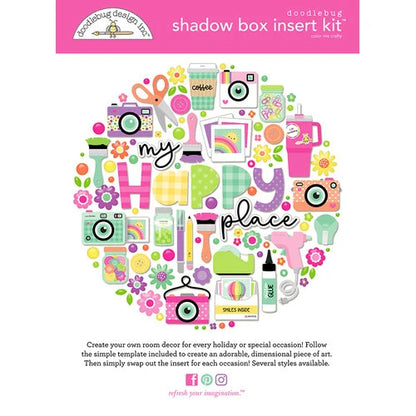 Doodlebug Design Inc. shadow box insert kit with colorful crafty scrapbooking themed elements on a white background.