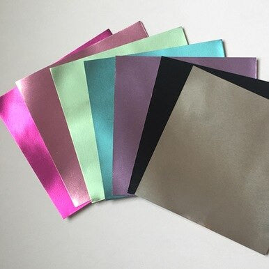 7 Luxurious Colors of Metallic Paper with Gold on the back of every piece.  6" x 6"
